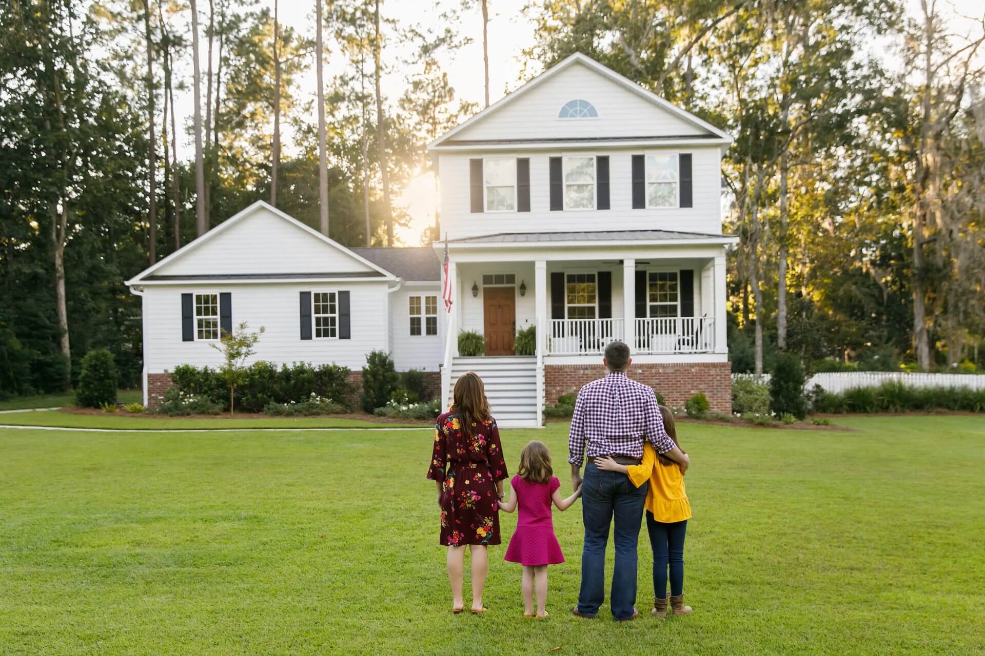 A family looking at their beautiful home